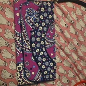 This is a Vera Bradley clutch wristlet in the retired "Boysenberry" pattern